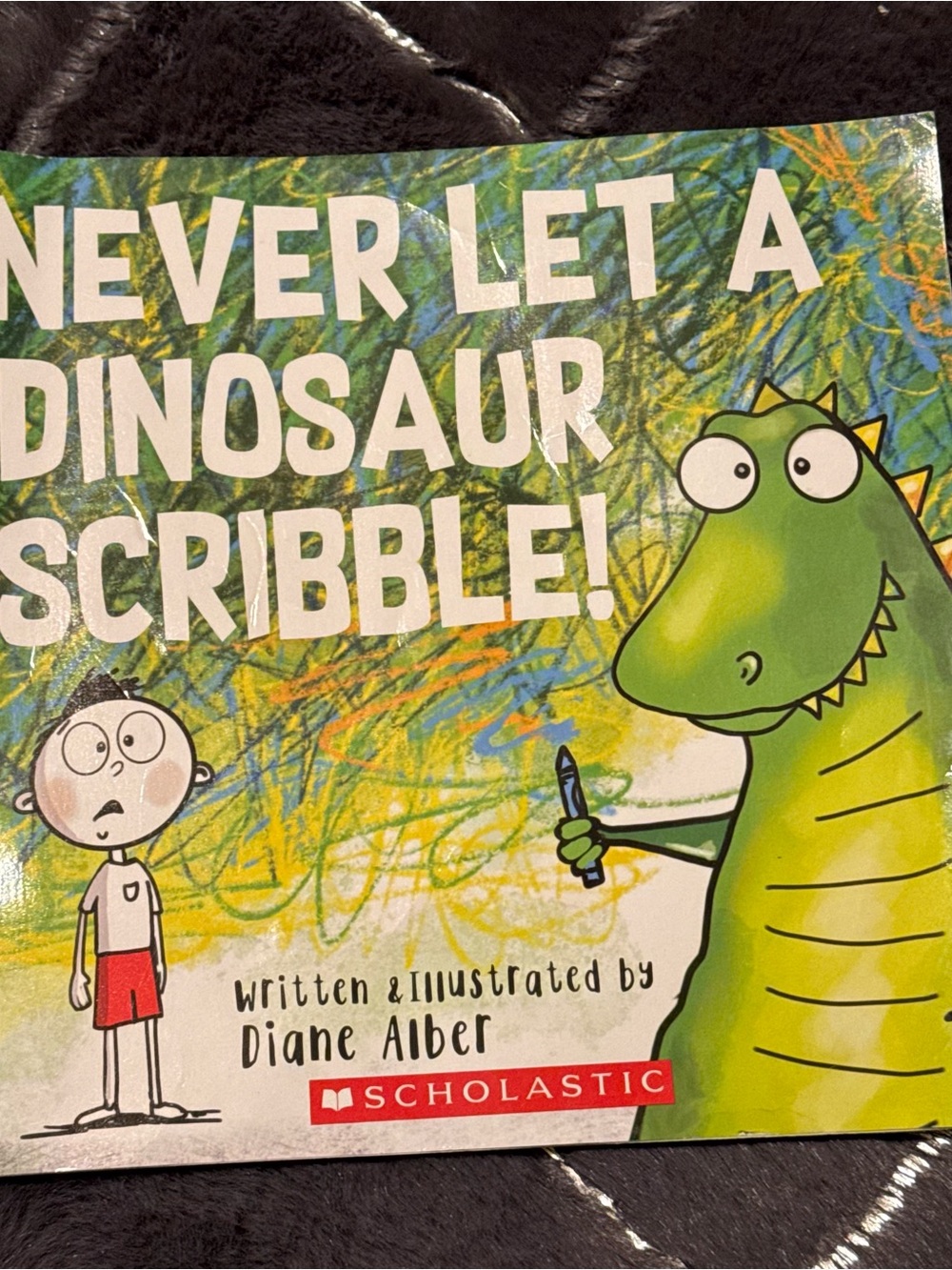 Never Let a Dinosaur Scribble Paperback